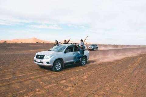 Travellers on a 4x4 jeep tour in the black desert of Merzouga