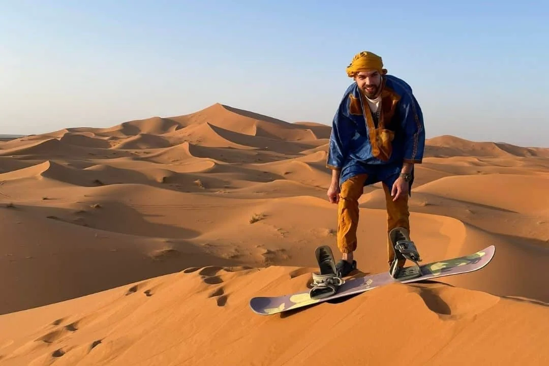 Merzouga sunset jeep tour: sandboarding on the dunes