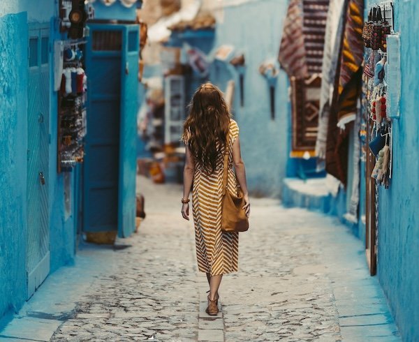 Woman in light long clothes and a scarf in Morocco, a modest and comfortable outfit for travel