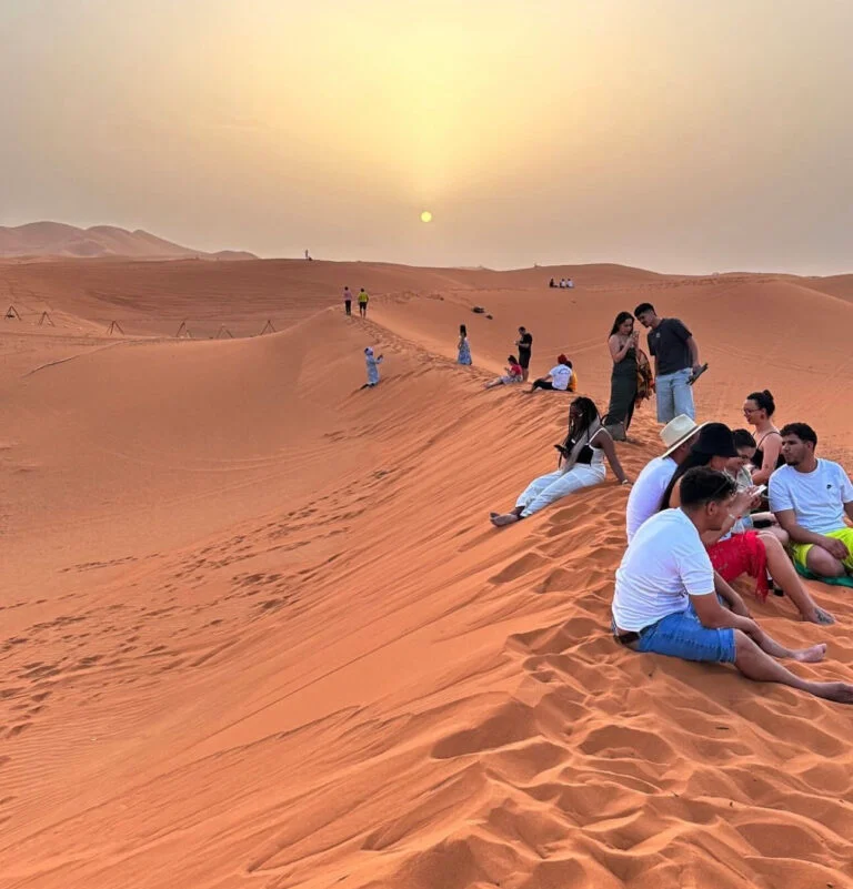 Desert sunset over the Erg Chebbi dunes near a camp in Merzouga